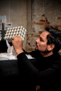 Ar. Abhimanyu Goel and Dr. Maxim Rybin arranging modular graphene concrete blocks for the Venice Biennale 2025 exhibition.